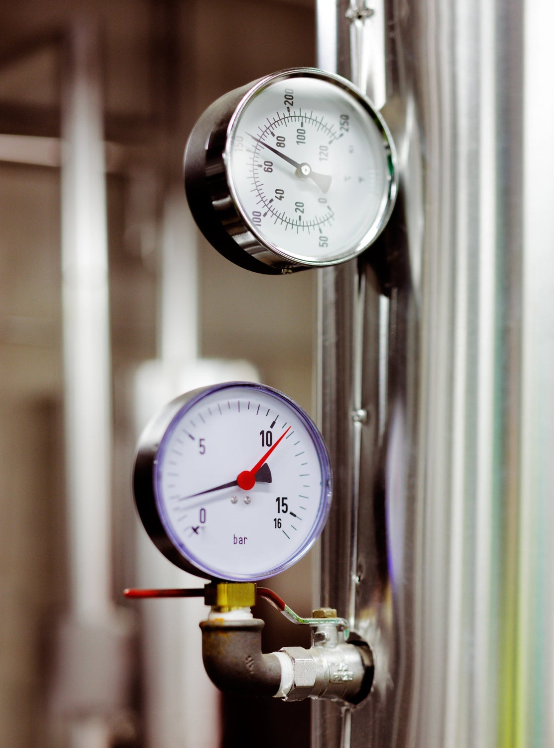 Two Temperature Gauges attached to vertical pipe