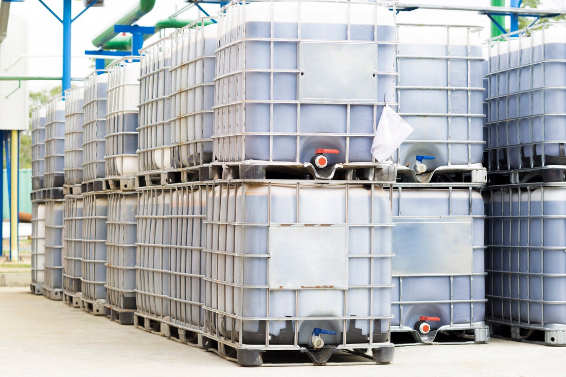 white ibc totes stacked on top of each other